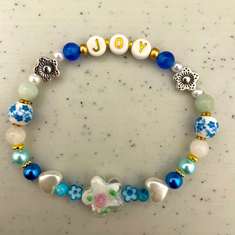 Blue “Joy” bracelet. Such a greatt gift for someone who brings you joy.